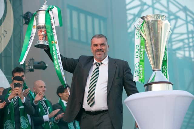 Ange Postecoglou holds aloft the Scottish Cup in front of gathered fans at Celtic Park after completing the domestic treble. (Photo by Ewan Bootman / SNS Gro