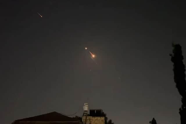 A video grab from AFPTV shows explosions lighting up Jerusalem sky during the Iranian attack on Israel. Picture: AFPTV/AFP via Getty Images