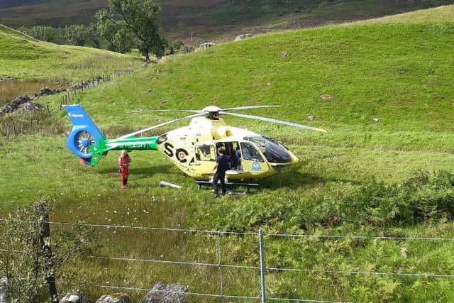 The Scotland's Charity Air Ambulance aircraft landing for the rescue. (Photo by Alastair Dalton/The Scotsman)