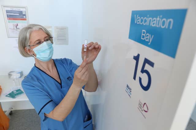 Gillian Bruce, co-ordinator with the immunisation team at NHS Forth Valley, loads a syringe with a vaccine at Forth Valley College's Stirling campus. Picture: Wednesday March 17, 2021