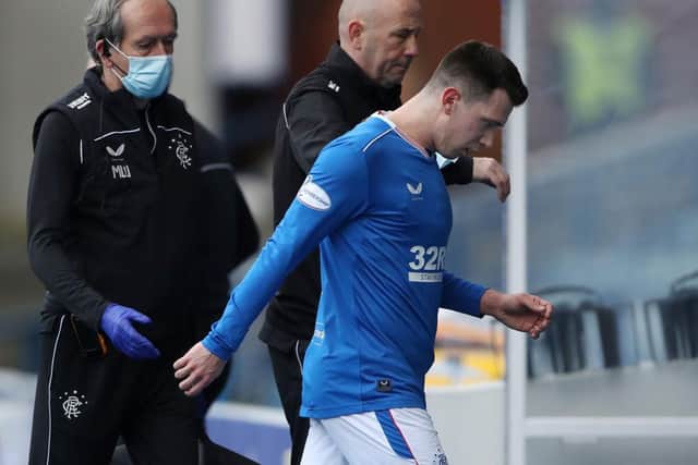 Ryan Jack of Rangers leaves the pitch after suffering an injury during the Ladbrokes Scottish Premiership match between Rangers and Dundee United at Ibrox Stadium on February 21, 2021 in Glasgow, Scotland. (Photo by Ian MacNicol/Getty Images)