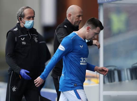 Ryan Jack of Rangers leaves the pitch after suffering an injury during the Ladbrokes Scottish Premiership match between Rangers and Dundee United at Ibrox Stadium on February 21, 2021 in Glasgow, Scotland. (Photo by Ian MacNicol/Getty Images)