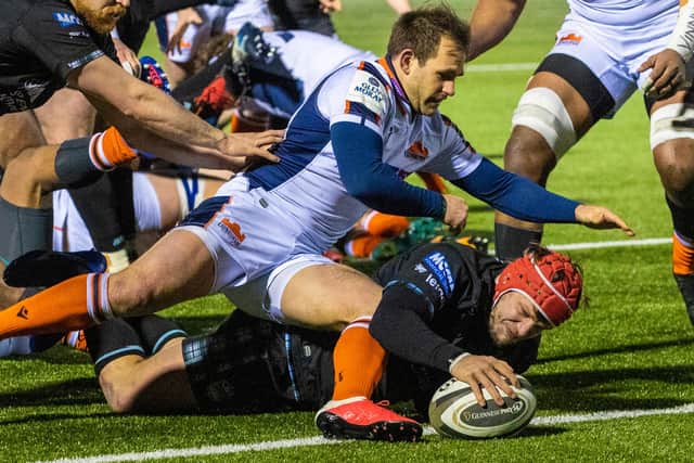 Hooker George Turner forces his way over for a second-half try in Warriors' 23-22 win over Edinburgh. Picture: Craig Williamson/SNS