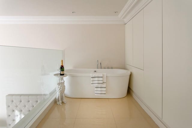 Fancy a glass of fizz? The standalone bath in the master bedroom is a standout feature of the apartment