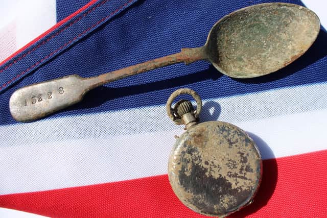 ~A spoon and a pocket watch, which belonged to Private William Johnston, 7th Battalion, Royal Scots Fusiliers, who was buried with full military honours at the Commonwealth War Graves Commission's Loos British Cemetery.
