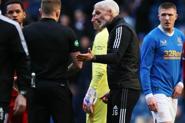 Aberdeen Manager Jim Goodwin with referee John Beaton at full-time.  (Photo by Craig Williamson / SNS Group)