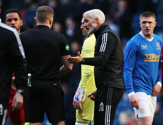 Aberdeen Manager Jim Goodwin with referee John Beaton at full-time. (Photo by Craig Williamson / SNS Group)