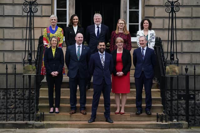 Newly elected First Minister of Scotland Humza Yousaf on the steps of Bute House, Edinburgh, with his cabinet after their first meeting. Picture date: Wednesday March 29, 2023.