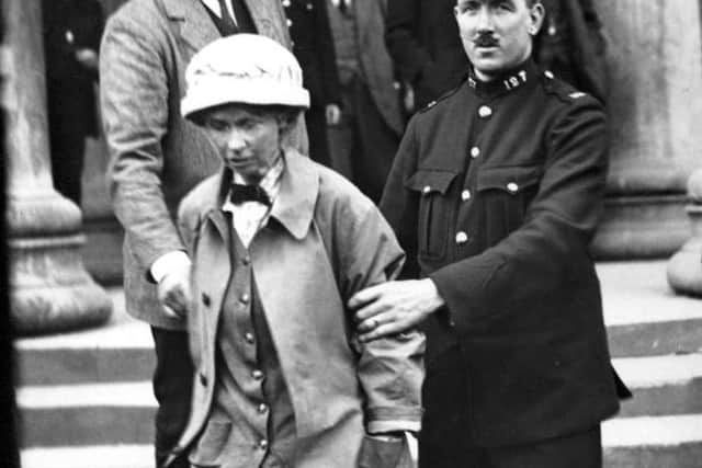 Frances Parker being led away from Ayr Sherrif Court after being charged with attempting to blow up Burns’ Cottage in Alloway in 1914. 
Frances Parker: Crown Copyright, National Records of Scotland, HH16/43/58). Public Domain
