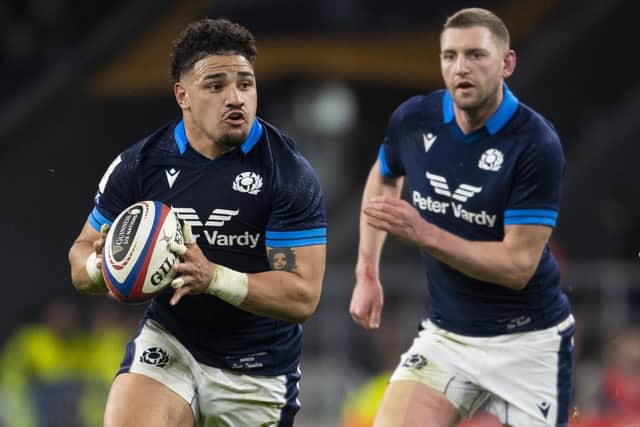 Sione Tuipulotu is flanked by Finn Russell during Scotland's win over England in the 2023 Six Nations opener at Twickenham. (Photo by Ross MacDonald / SNS Group)