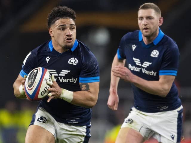 Sione Tuipulotu is flanked by Finn Russell during Scotland's win over England in the 2023 Six Nations opener at Twickenham. (Photo by Ross MacDonald / SNS Group)