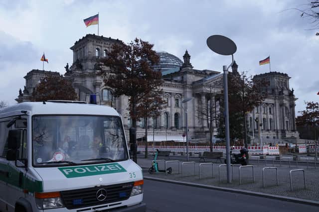 A police van stands outside the Reichstag in Berlin as police conduct nationwide raids against people suspected of involvement in a far-right coup plot (Picture: Sean Gallup/Getty Images)