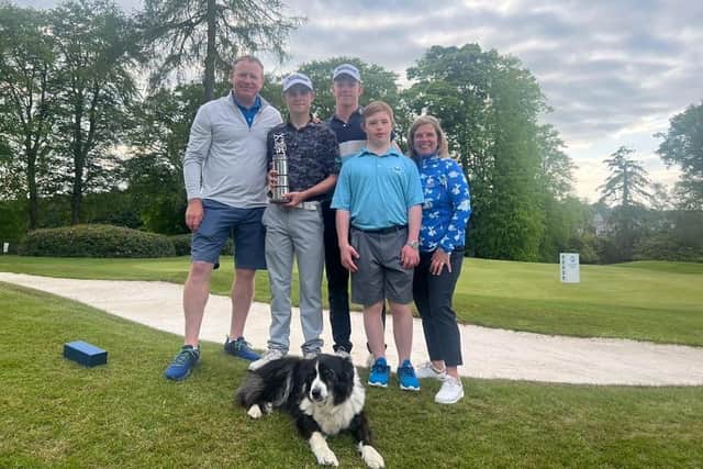 Conor Graham celebrates his four-shot success in the Scottish Men's Open at Meldrum House last weekend with his mum June, dad Stuart, brothers Gregor and Archie and the family dog Bonzo. Picture: Scottish Golf