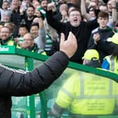 Celtic manager Ange Postecoglou takes the adulation of fans during a victory over Rangers.