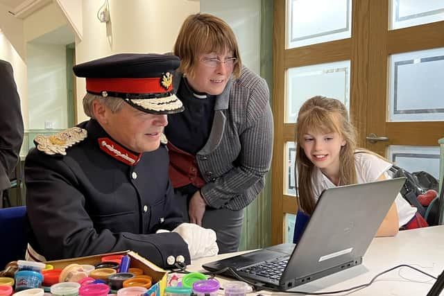 Vittoria Hancock and Amelie Pole show the Lord-Lieutenant how to film stop motion.