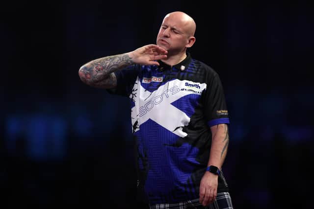 Alan Soutar reacts to a missed dart during his loss to Gabriel Clemens in the last 16 of the Cazoo World Darts Championship at Alexandra Palace. (Photo by Mike Owen/Getty Images)