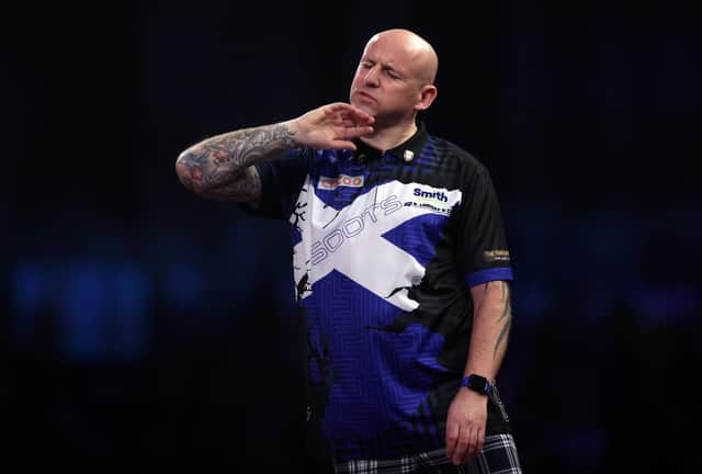 Alan Soutar reacts to a missed dart during his loss to Gabriel Clemens in the last 16 of the Cazoo World Darts Championship at Alexandra Palace. (Photo by Mike Owen/Getty Images)