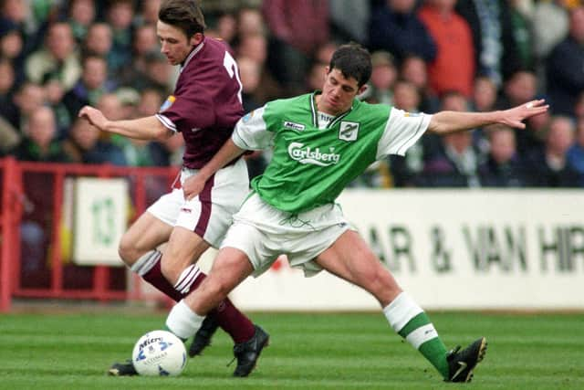 Stevie Crawford playing in an Edinburgh derby against Hearts' Neil McCann during his Hibs days.