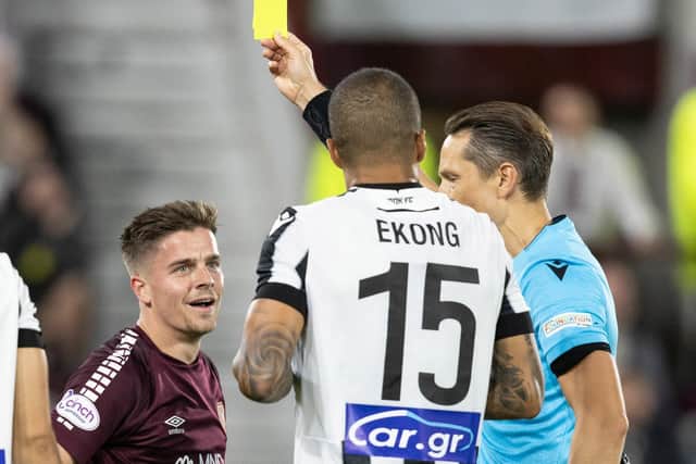 Hearts midfielder Cammy Devlin is shown a yellow card during the 2-1 defeat to PAOK at Tynecastle. (Photo by Ross Parker / SNS Group)