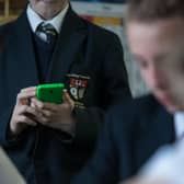 School pupils should not be allowed to muck around on their mobile phones in the classroom (Picture: Matt Cardy/Getty Images)
