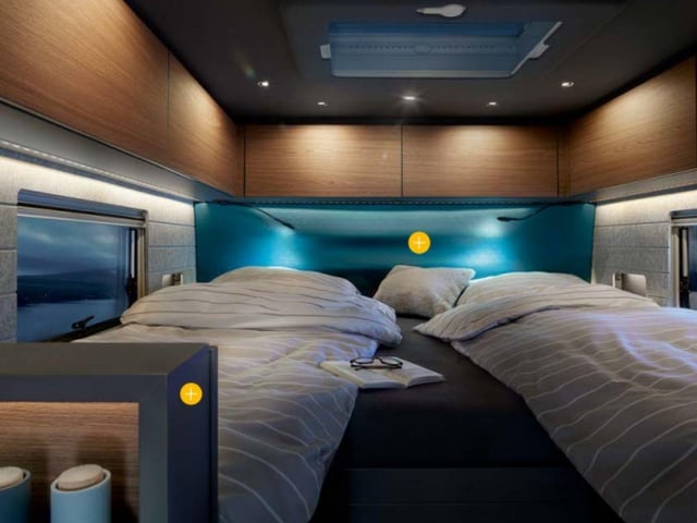 The main bedroom area comes with two bedding options - two single beds or a queen-sized 'island' bed measuring 140×200 cm. A sliding door seperates the sleeping and living areas.