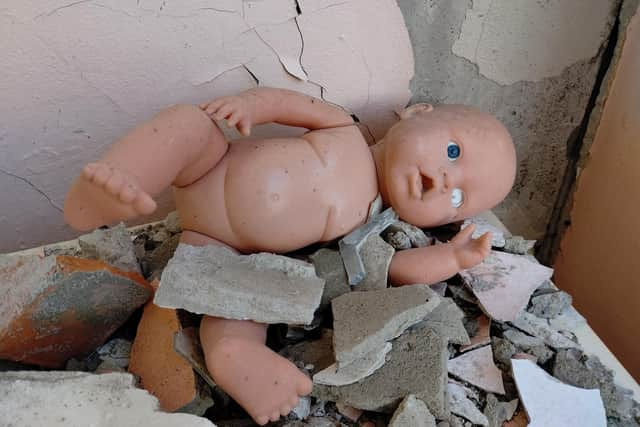 A picture taken by Oleg Dmitriev in a bombed out nursery in the Kharkiv suburb of Pivnichna Saltyvka shows children's toys amongst the rubble.