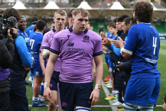 Scotland's Luke McConnell walks through the Italian guard of honour after the 17-40 defeat at Scotstoun in the Under-20 Six Nations. (Photo by Ross MacDonald / SNS Group)
