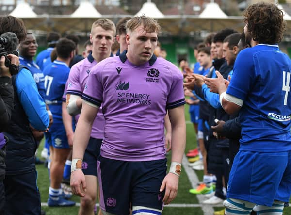 Scotland's Luke McConnell walks through the Italian guard of honour after the 17-40 defeat at Scotstoun in the Under-20 Six Nations. (Photo by Ross MacDonald / SNS Group)