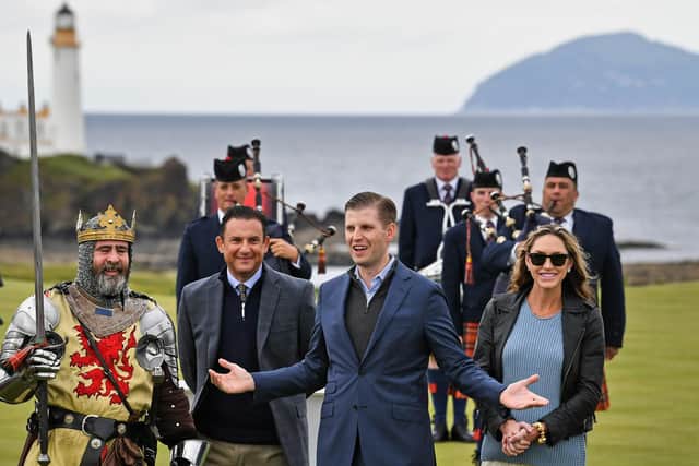 Eric Trump, accompanied his wife, Lara, attend the ceremonial ribbon cutting ceremony of a resigned course at Turnberry. The event featured an actor dressed as Robert the Bruce. Picture: Jeff J Mitchell/Getty