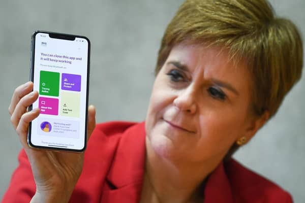 First Minister Nicola Sturgeon with the Protect Scotland app. (Photo by Jeff J Mitchell/Getty Images)