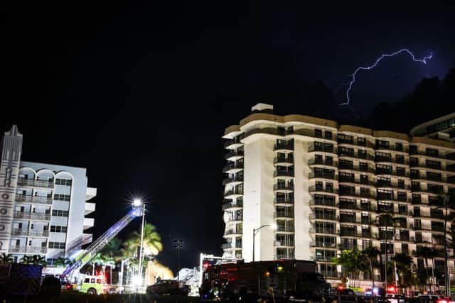 A large section of the Champlain Towers South condominium in Surfside, a barrier island town across Biscayne Bay from the city, crumbled to the ground, authorities said.