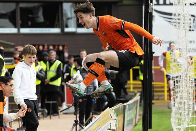 Dundee United's Chris Mochrie celebrates scoring the winning goal against Ayr United that has effectively sealed promotion back to the Premiership.  (Photo by Mark Scates / SNS Group)