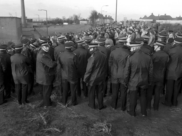 Police keep miners and the NUM picket line back outside Bilston Glen colliery during the miners strike in January 1985.
