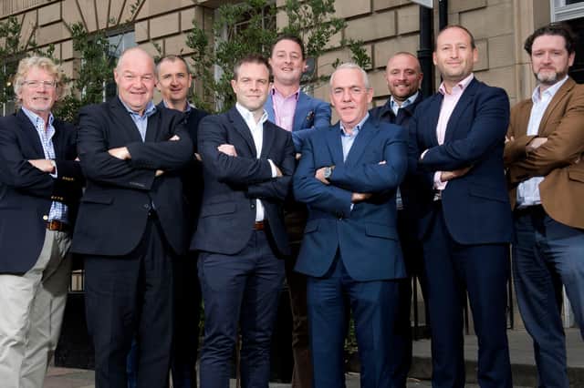PMP chairman John Dunn (far left) pictured with team members before Covid-19 measures come into force.