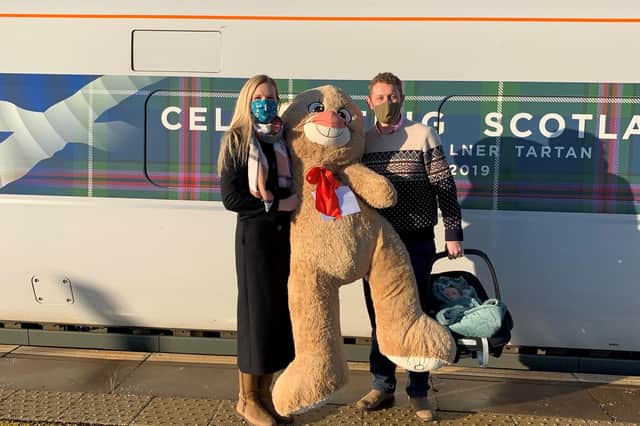 Major Tim and Dr Emily Barker with the bear for their daughter Evelyn, aged three, at Leuchars Train Station picture: LNER