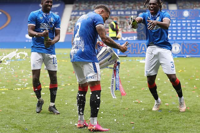 Glen Kamara, James Tavernier, Calvin Bassey celebrate during the Scottish Premiership match between Rangers and Aberdeen on May 15, 2021 in Glasgow, Scotland. Sporting stadiums around the UK remain under strict restrictions due to the Coronavirus Pandemic as Government social distancing laws prohibit fans inside venues resulting in games being played behind closed doors.  (Photo by Ian MacNicol/Getty Images)
