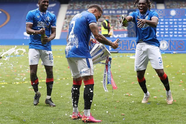 Glen Kamara, James Tavernier, Calvin Bassey celebrate during the Scottish Premiership match between Rangers and Aberdeen on May 15, 2021 in Glasgow, Scotland. Sporting stadiums around the UK remain under strict restrictions due to the Coronavirus Pandemic as Government social distancing laws prohibit fans inside venues resulting in games being played behind closed doors. (Photo by Ian MacNicol/Getty Images)