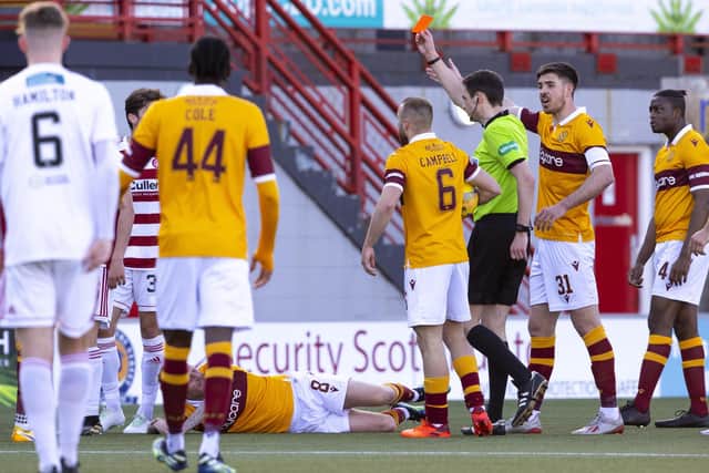 Ronan Hughes of Hamilton is sent off by referee Kevin Clancy. Motherwell won the match 1-0.