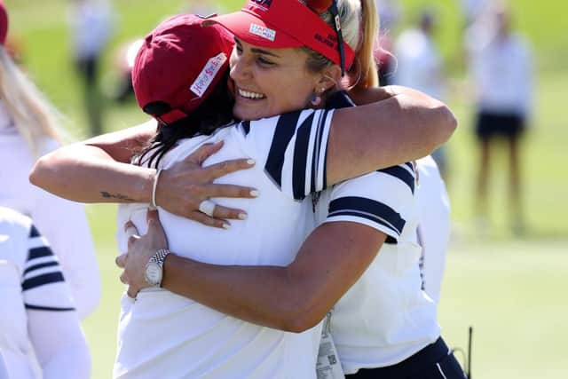 Lexi Thompson hugs US captain Patty Hurst after holing a 25-foot match-winning putt on the second morning of the 17th Solheim Cup in Toledo, Ohio. Picture: Gregory Shamus/Getty Images.