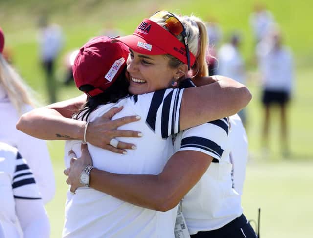 Lexi Thompson hugs US captain Patty Hurst after holing a 25-foot match-winning putt on the second morning of the 17th Solheim Cup in Toledo, Ohio. Picture: Gregory Shamus/Getty Images.