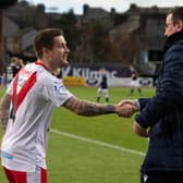 Airdrie player-manager Rhys McCabe and Dundee manager Gary Bowyer during a Scottish Cup third round match.