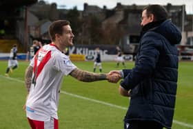Airdrie player-manager Rhys McCabe and Dundee manager Gary Bowyer during a Scottish Cup third round match.