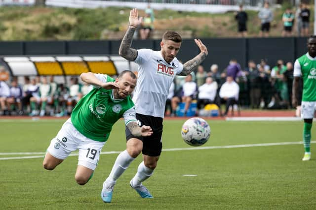 Hibs striker Adam Le Fondre goes down in the box under the challenge of Edinburgh City's Lee Hamilton.  (Photo by Craig Williamson / SNS Group)