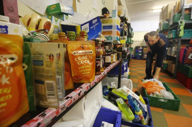 The cost-of-living crisis, in which increasing numbers of people rely on food banks, has also made the social security system more important (Picture: Danny Lawson/PA)