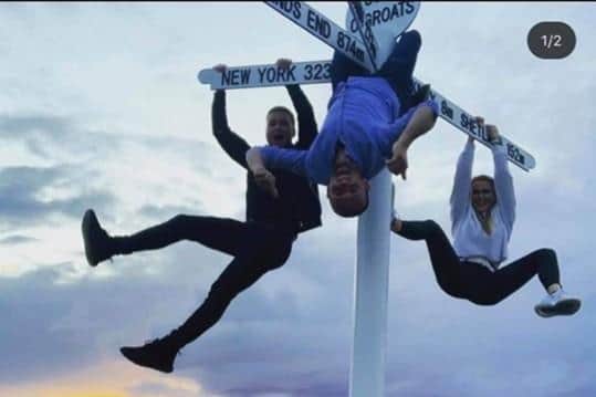 The John O'Groats Development Trust shared pictures of others swinging on the sign previously.
