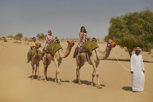 Camel riding in the desert, Dubai. Pic: Bab Al Shams/PA
