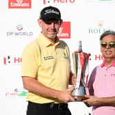 Stephen Gallacher, pictured receiving the trophy from Pawan Munjal of Hero after winning the 2019 Hero Indian Open at the DLF Golf & Country Club in New Delhi, speaeheads a strong home challenge on home soil in this week's Hero Open at Fairmont St Andrews. Picture: Ross Kinnaird/Getty Images.