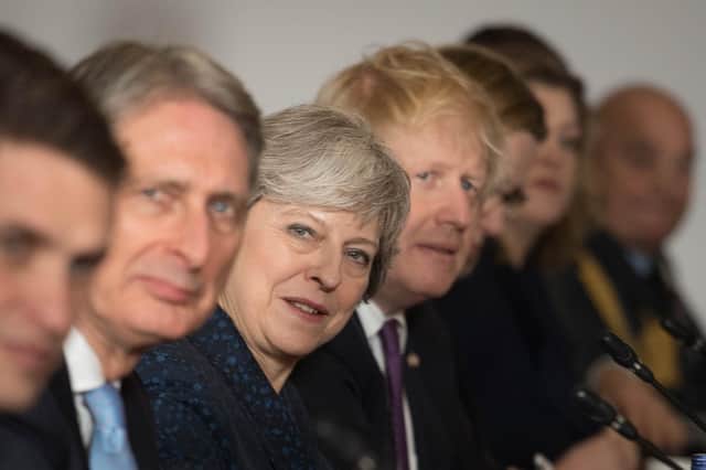 Theresa May and Boris Johnson are seen during a UK-France summit in January 2018, when she was Prime Minister and he was Foreign Secretary (Picture: Stefan Rousseau/WPA pool/Getty Images)
