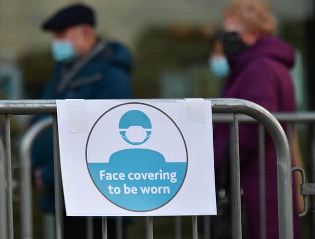 Face coverings should still be worn, experts have said. Picture: John Devlin