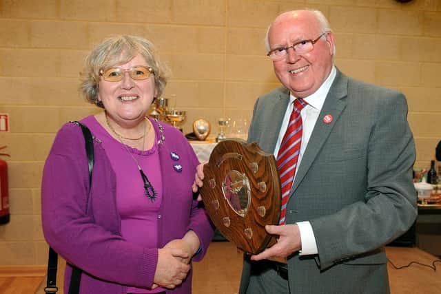 Cllr Francis McGlenshy being presented the 'Starthkelvin Ward' trophy by MP Tom Clark